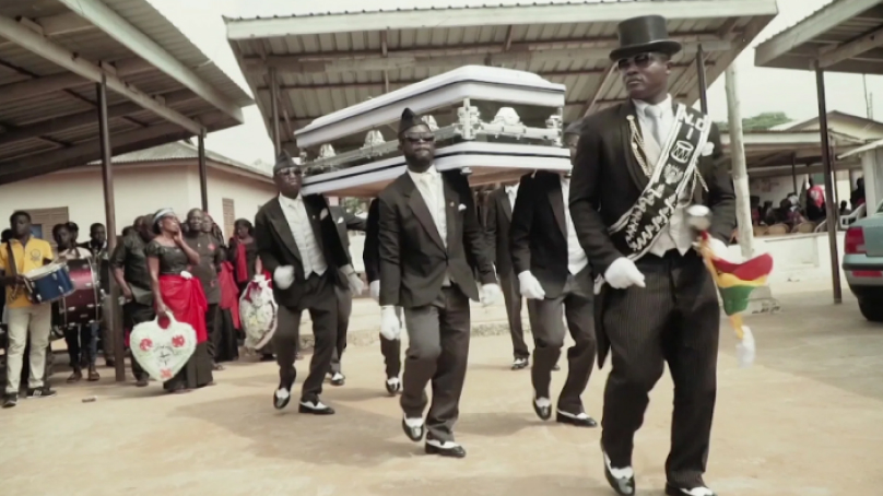 Ghana Pallbearers performing their iconic dance routine at a funeral procession.